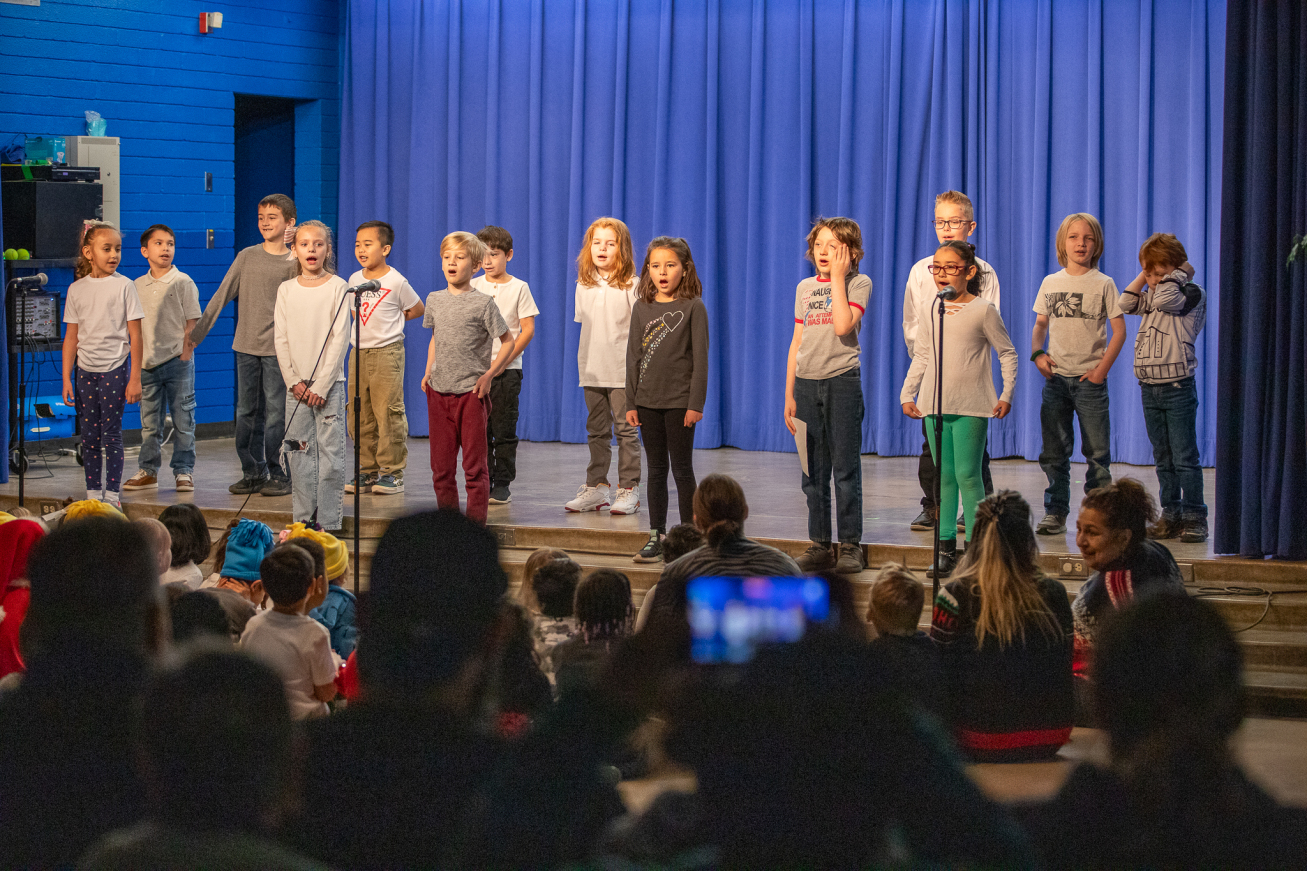 Students on stage during the holiday performance