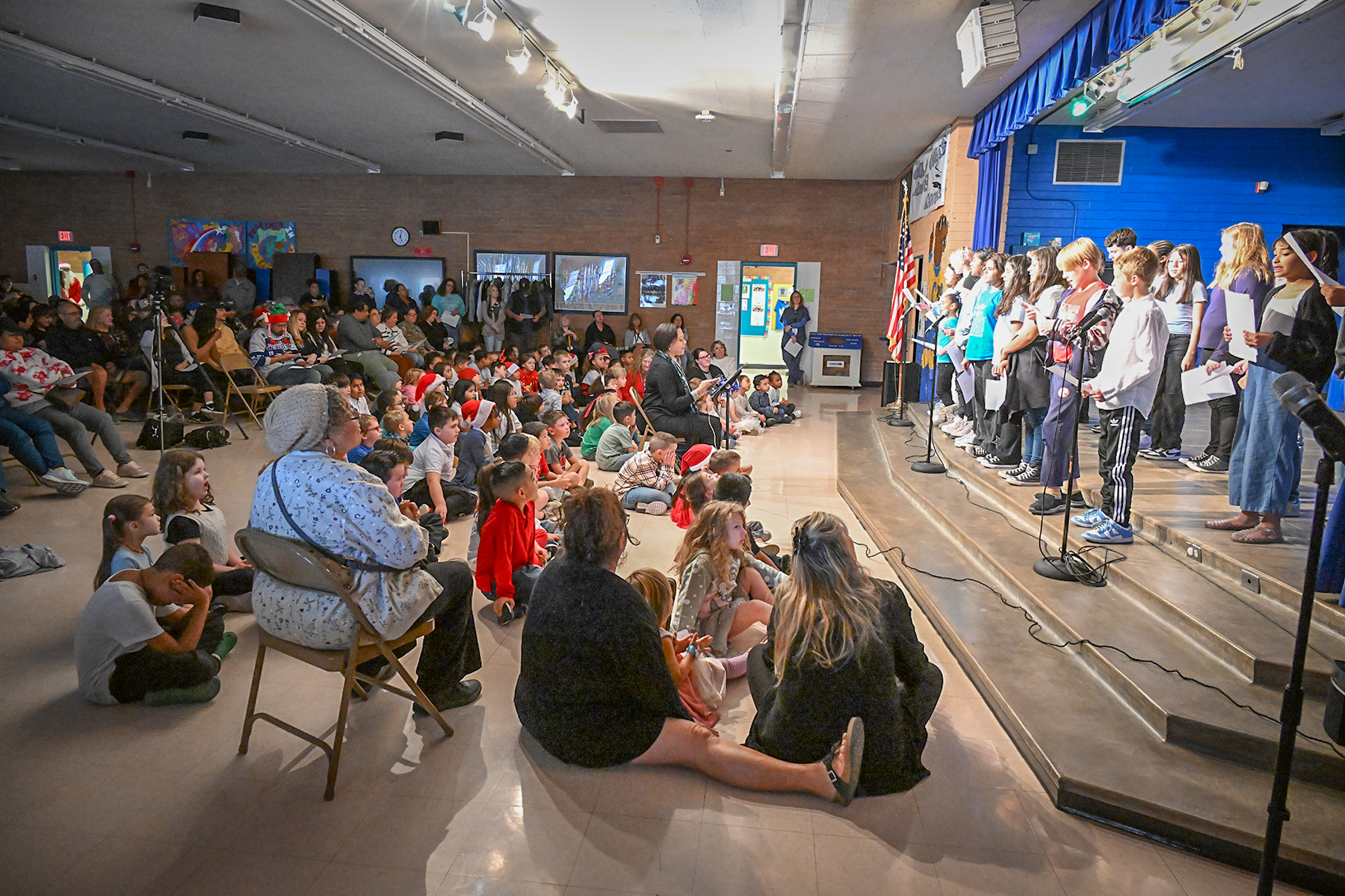 Families watch the performance in the cafeteria