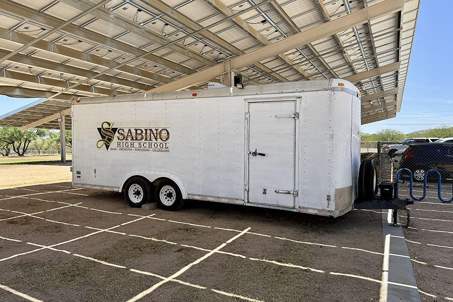 Sabino High School's marching band trailer parked under the solar shades
