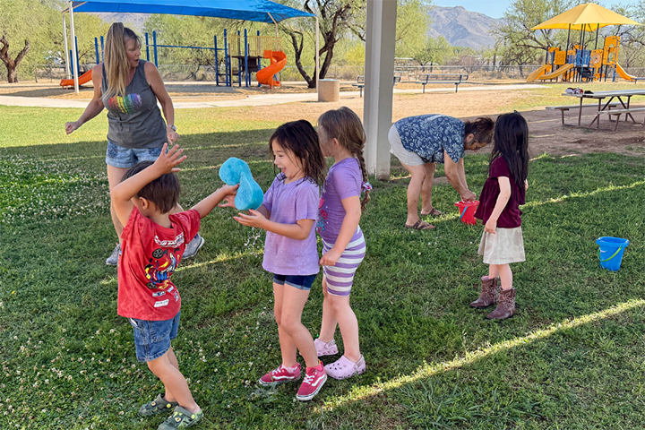 Students pass around a wet sponge