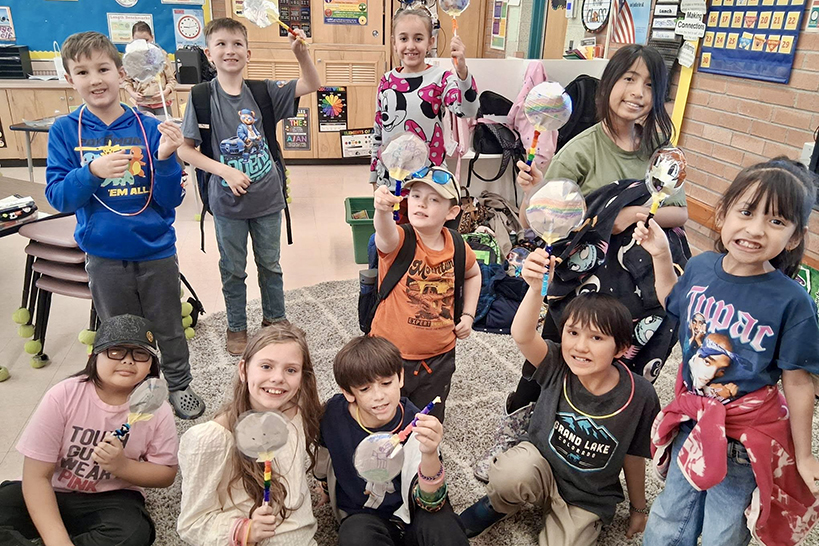 Students show off their foil balloons